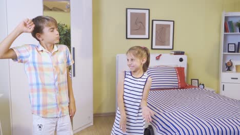 Two-children-are-dancing-in-the-room.